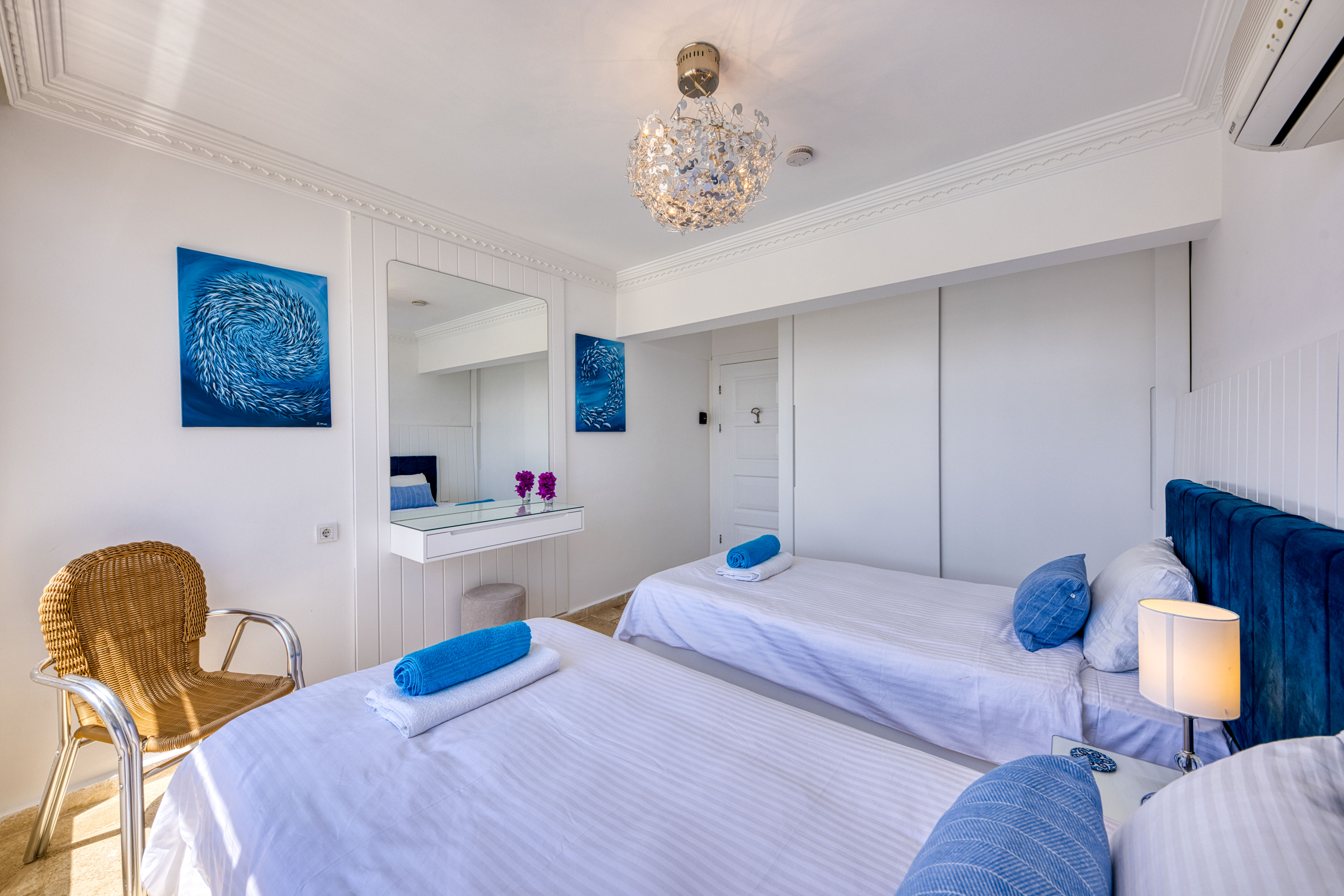 Bright and airy twin bedroom filled with natural light.
