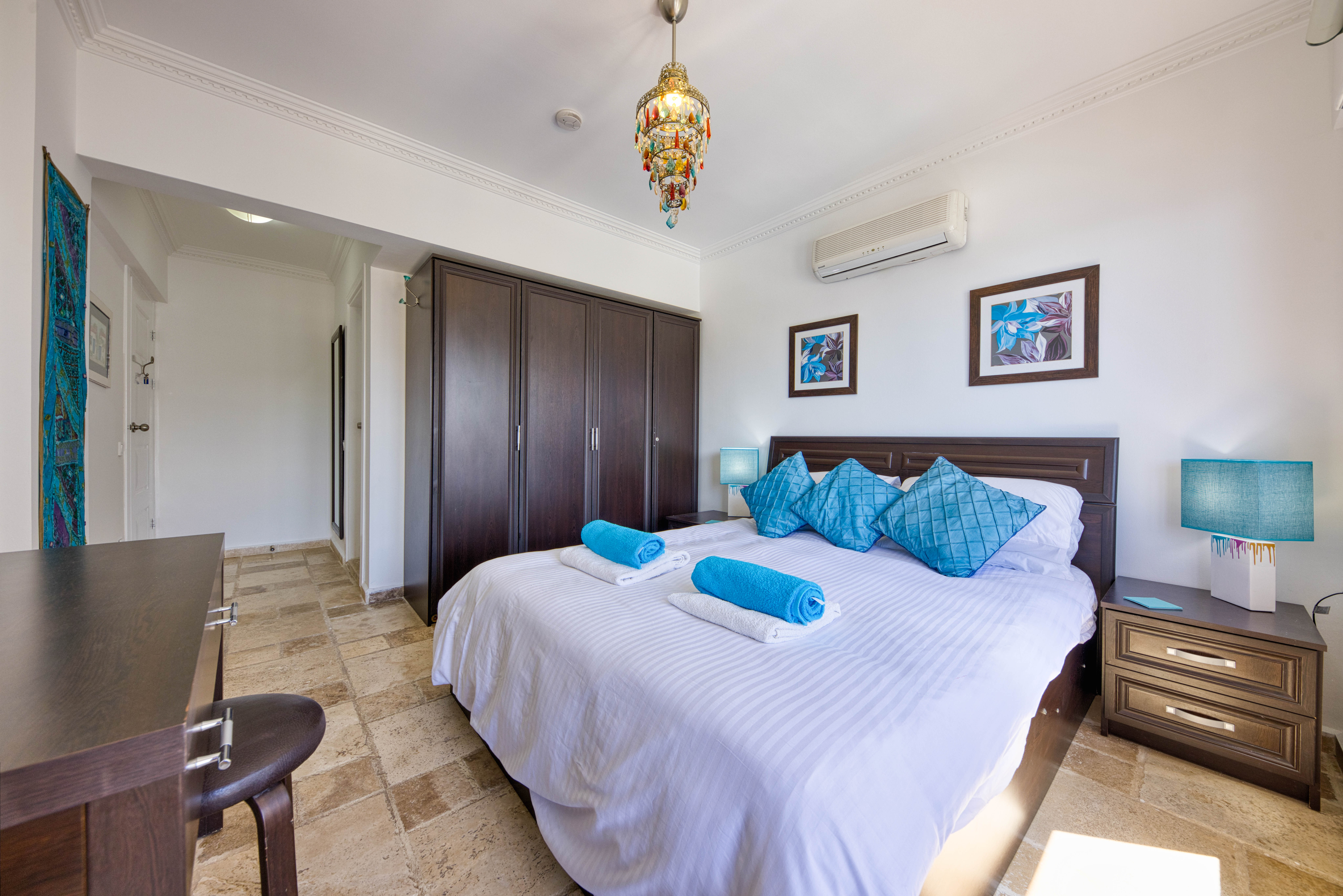Bright and comfortable master bedroom with ample storage.