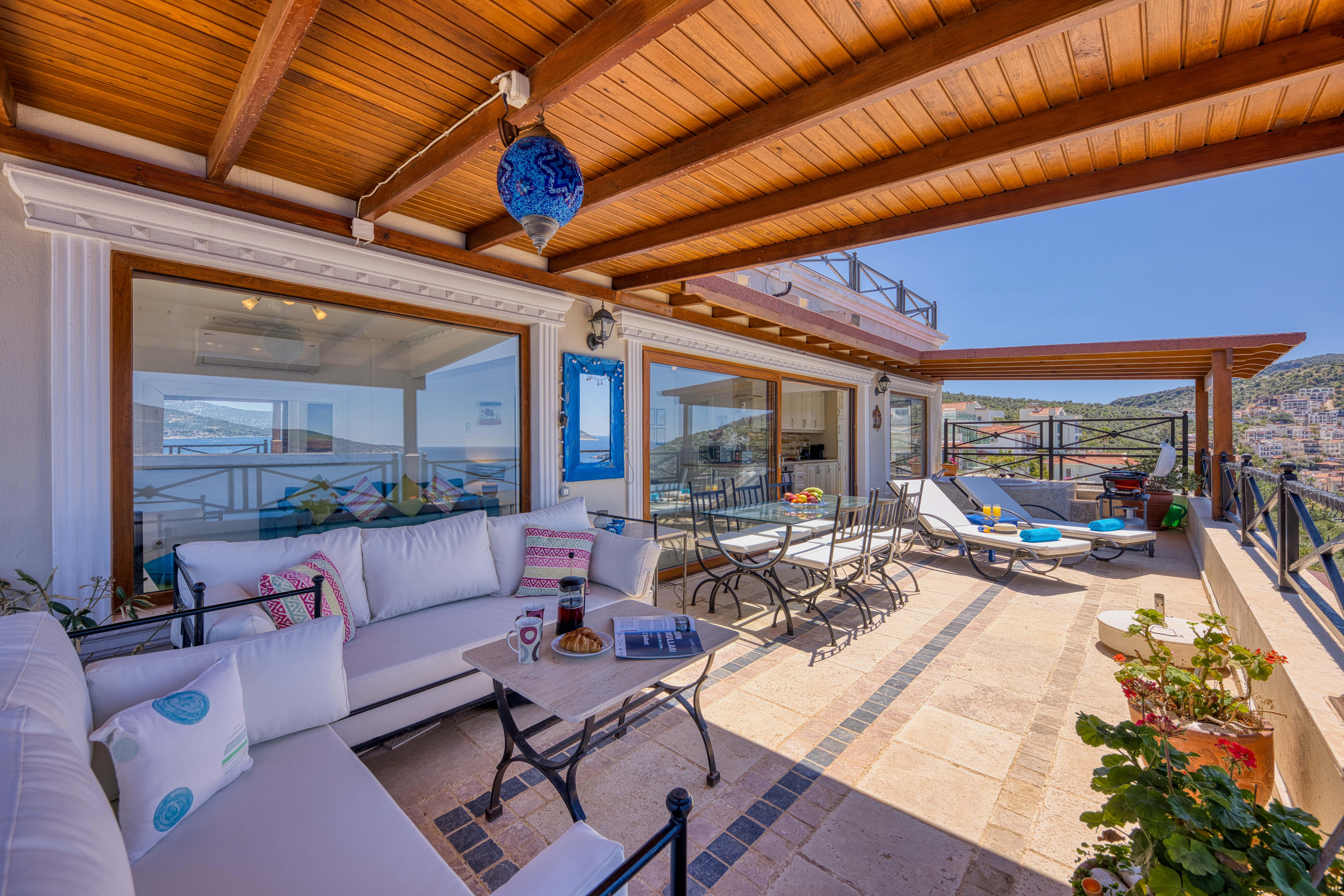 Sofas and Sunbeds on a private balcony for relaxing and enjoying the view
